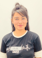 "Portrait of Sandeep Kaur Bhullar, Business Development Executive at XTRIM DIGITECH, wearing a black and white t-shirt with a confident and cheerful expression."