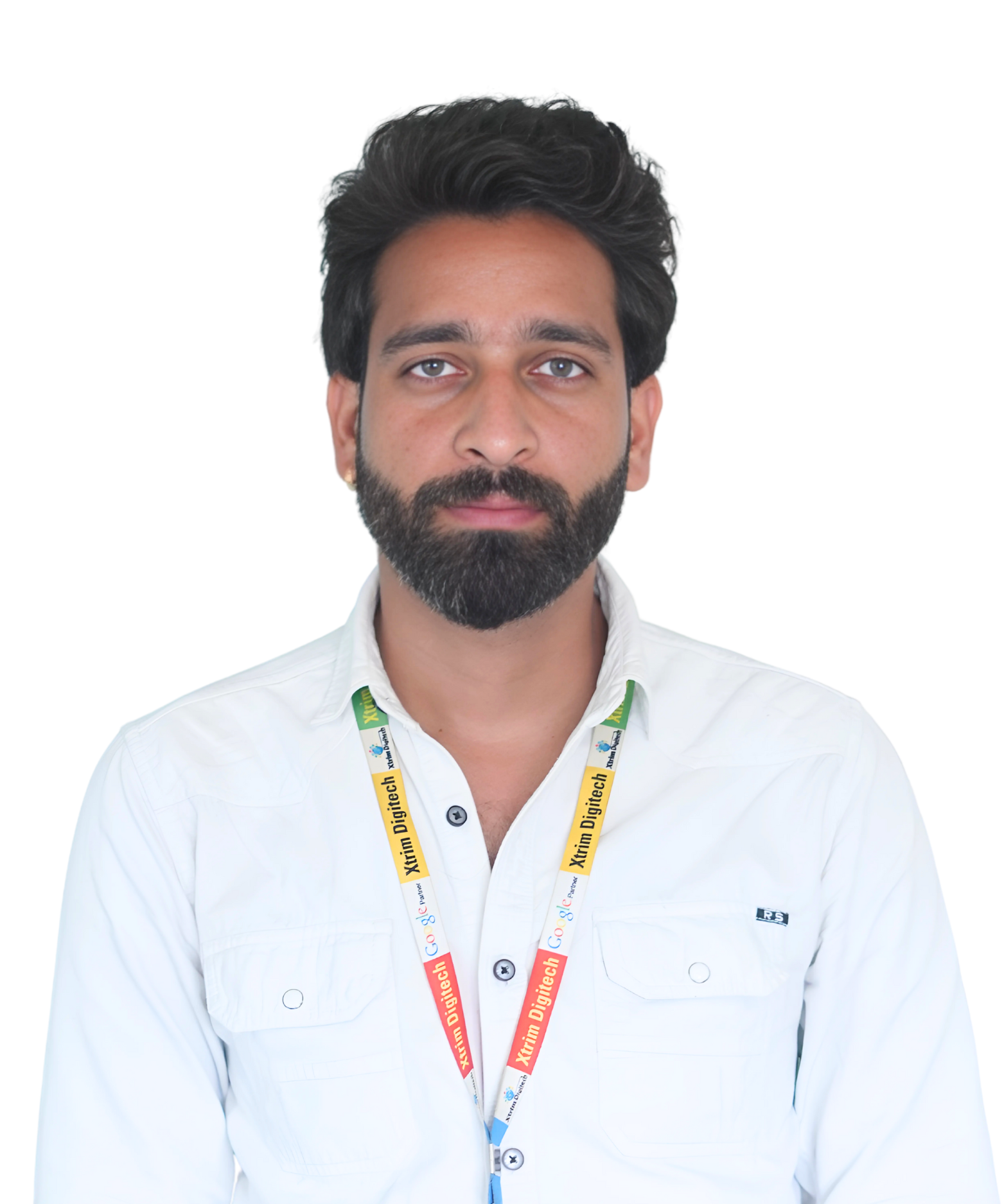 Anand, a man with a beard in a white shirt, posing confidently with arms crossed.