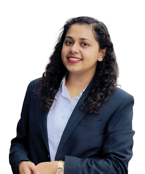 A person named Rishika, wearing a suit with a white shirt, smiling and looking confident. Rishika works as an HR at Xtrim Digitech.