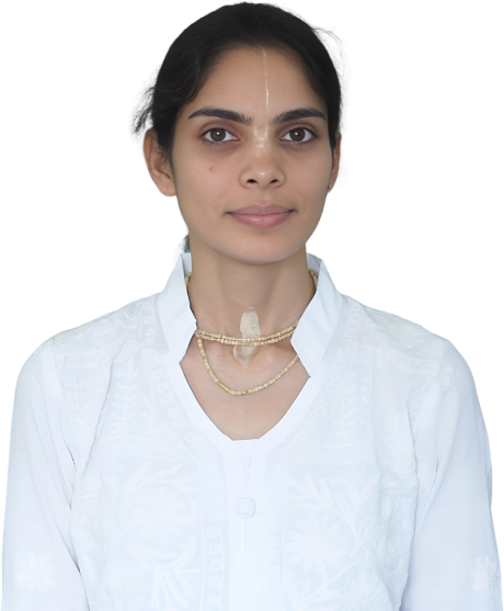 Sonam, a website developer, wearing traditional white attire and a calm expression.