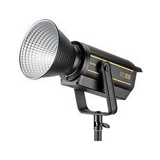 Professional studio spotlight with reflector attached to an adjustable mount, labeled VL300, displayed against a white background.